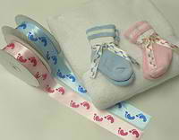 Personalized ribbon and baby booties available from Initaial It Please